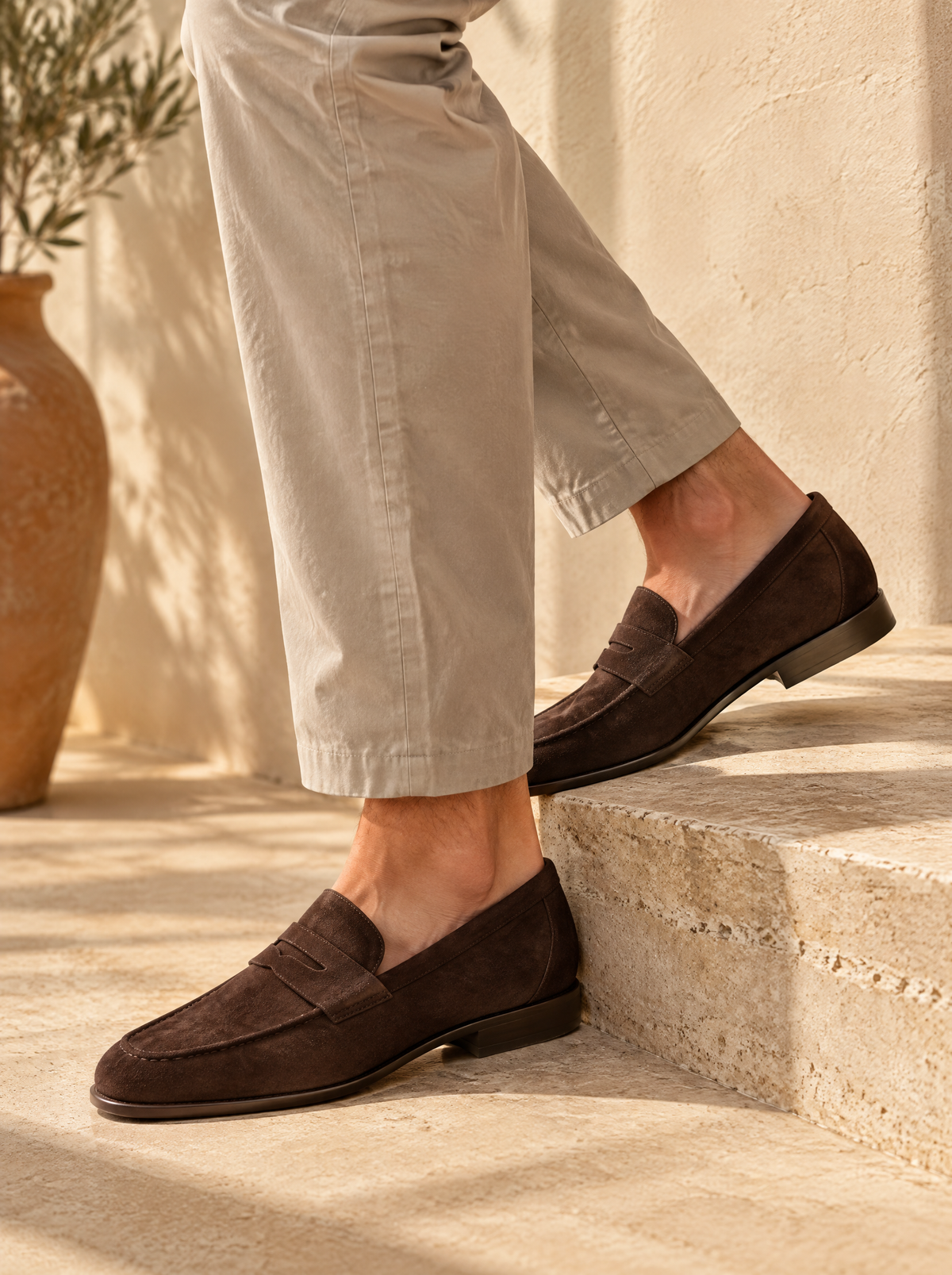 Man wearing generic suede loafers and stone chinos